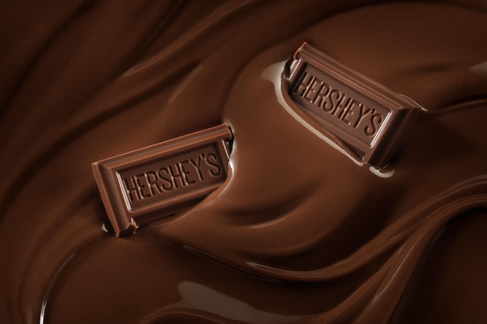 Hershey's chocolate bars in pool of chocolate after digital retouching