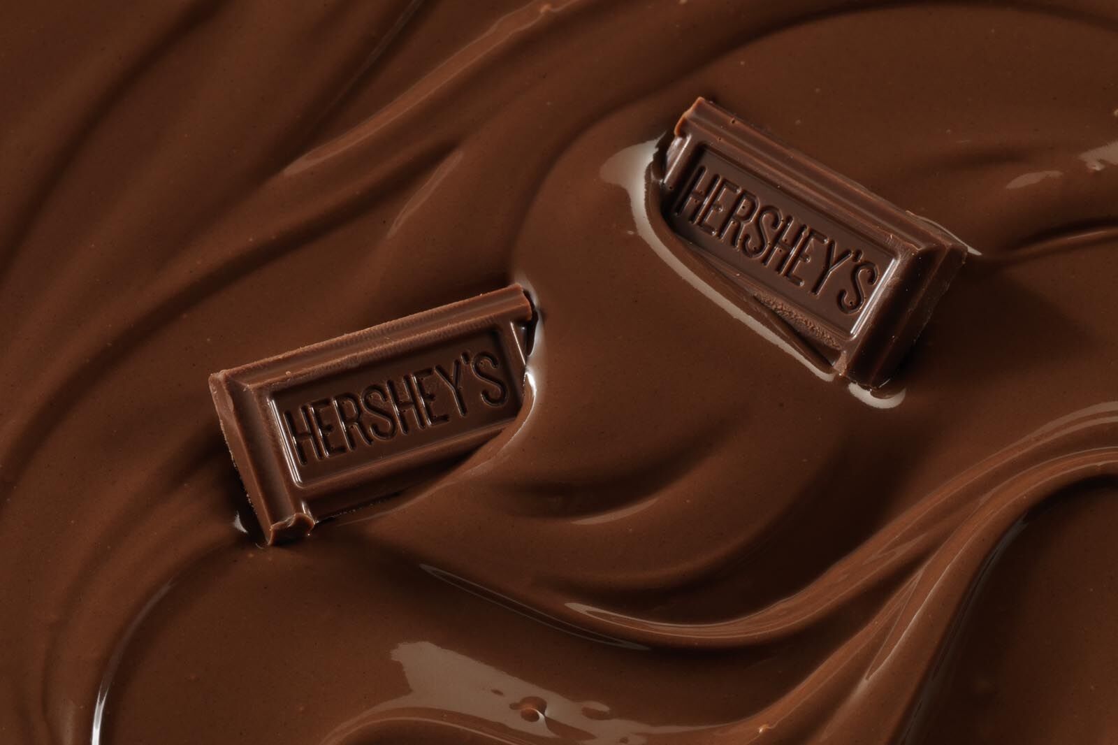 Hershey's chocolate bars in pool of chocolate before digital retouching