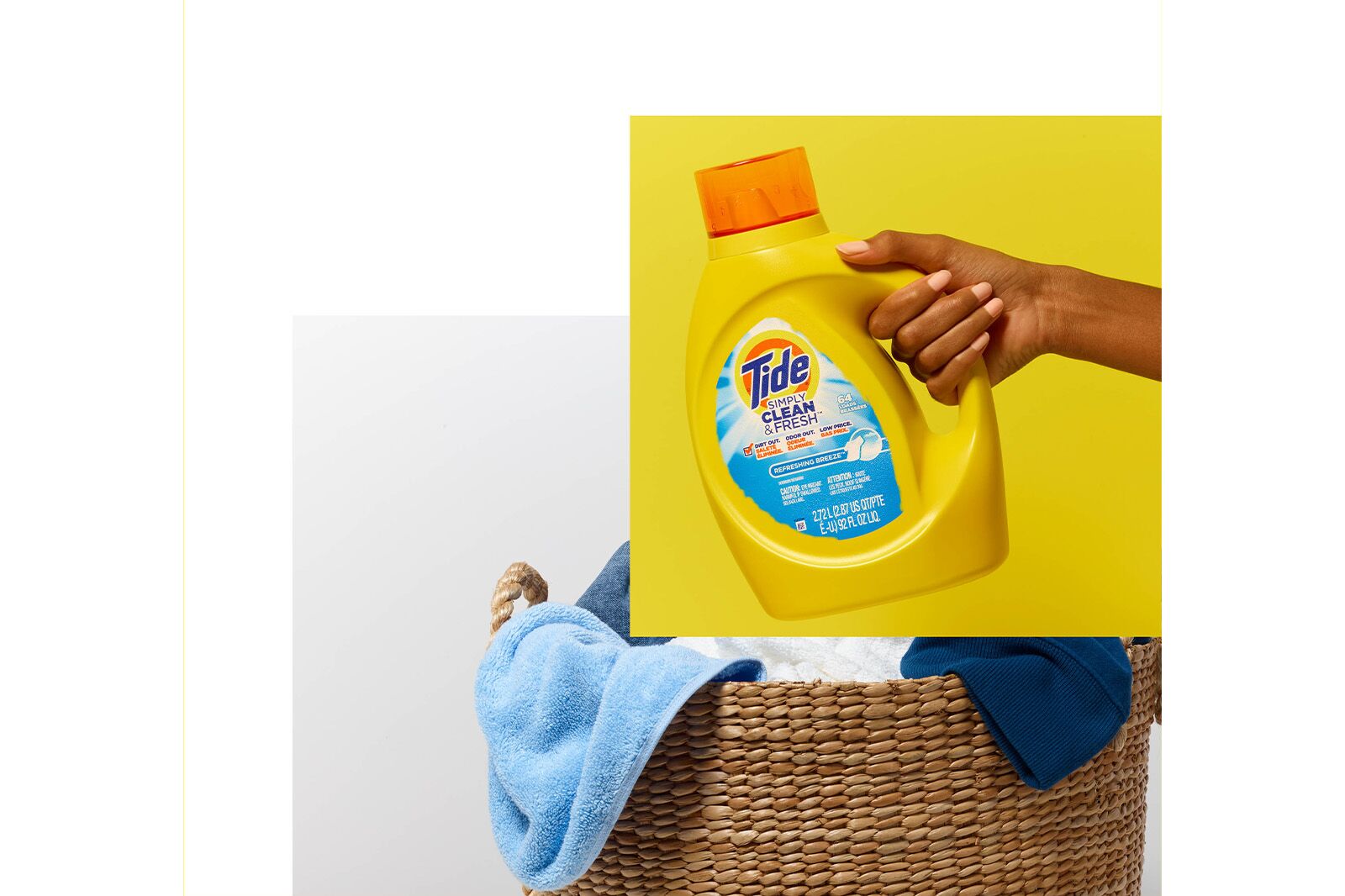 Bottles and hand of Tide product before retouching